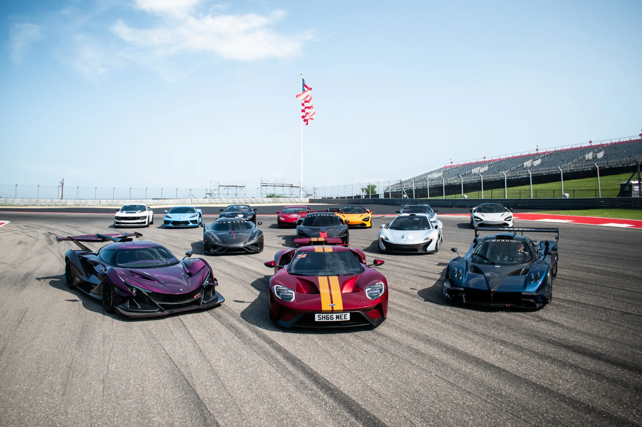 Eleven hypercars lined up at Circuit of the Americas under the American flag